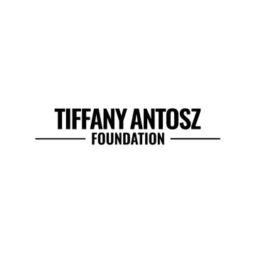 Tiffany Antosz Foundation logo in black block text against white background. Capital letters read "TIFFANY ANTOSZ" followed by smaller text below reading "FOUNDATION".